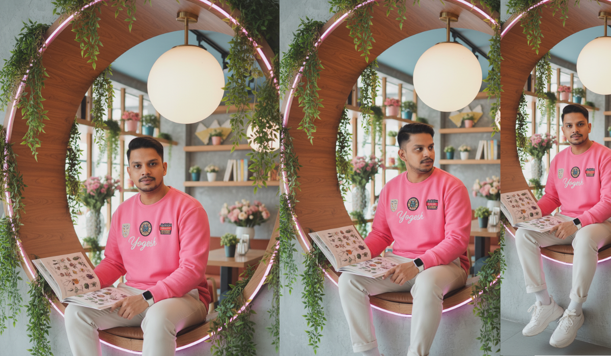 AI Prompt Photo: Yogesh sitting in a circular wooden nook with hanging plants and neon lights, holding a flower book, cozy indoor cafe vibe.
